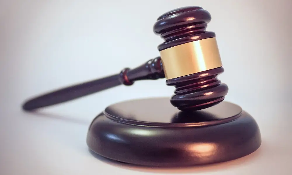Wooden judge's gavel on a sound block